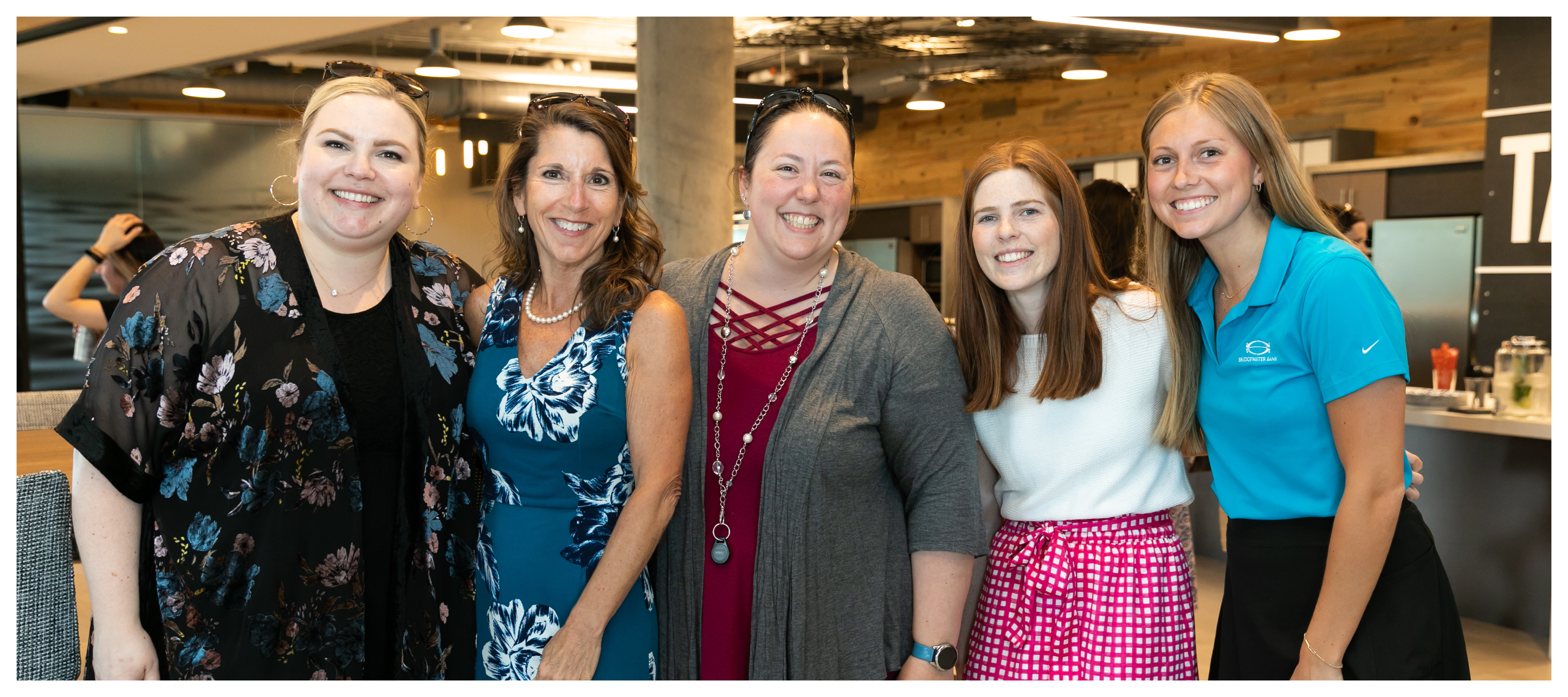 Group photo of CashBank Group women at an internal happy hour.